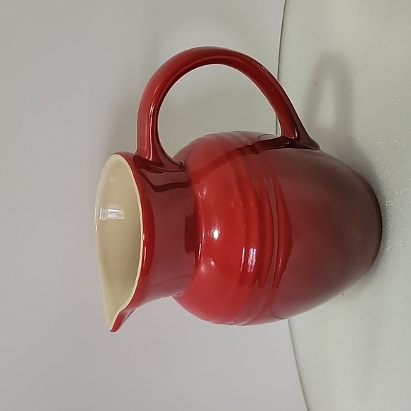 Le Creuset Kitchen Le Creuset Red And Cream Pitcher Poshmark